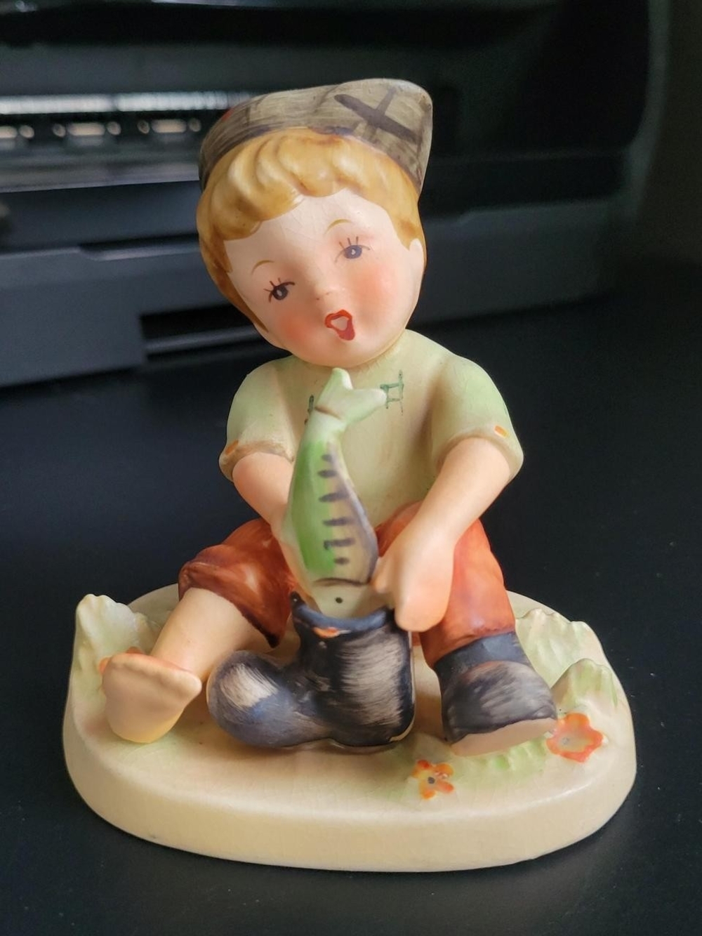 Vintage NAPCO ceramic boy with a fish figurine